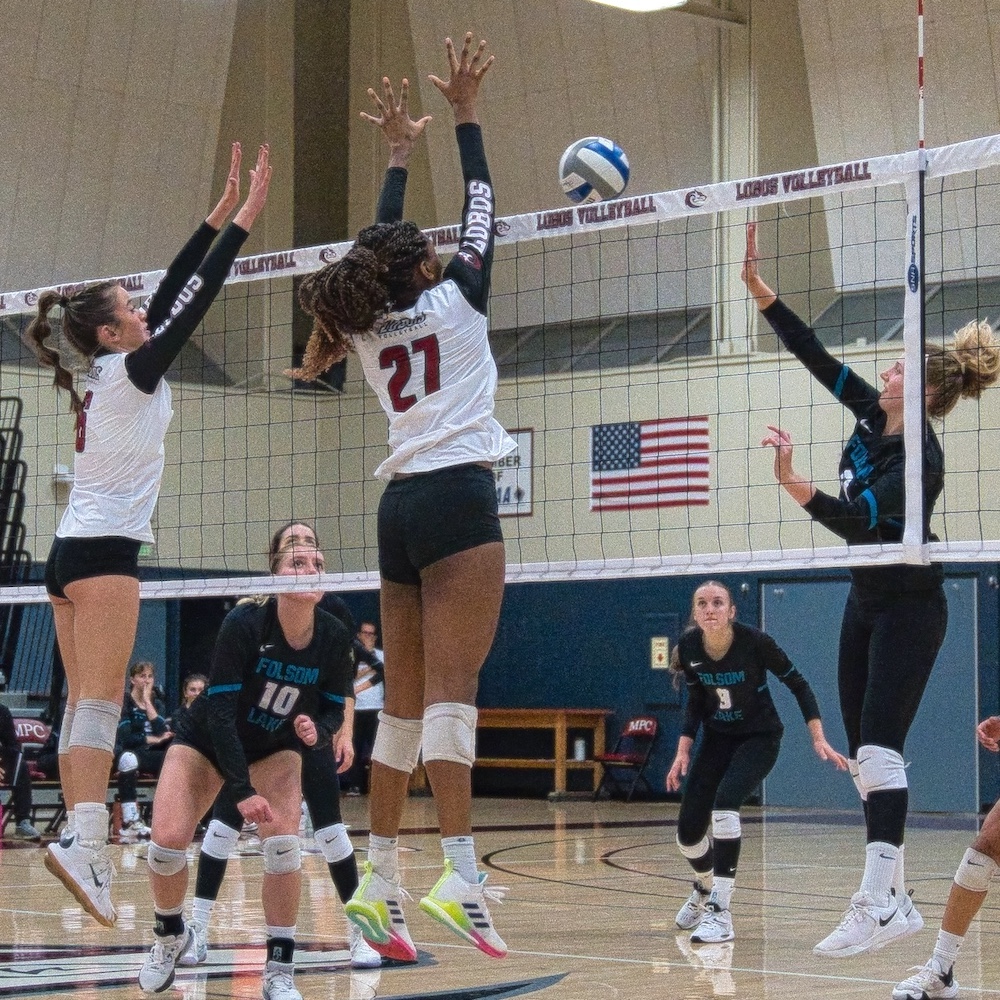 MPC Volleyball Players Blocking Opponent