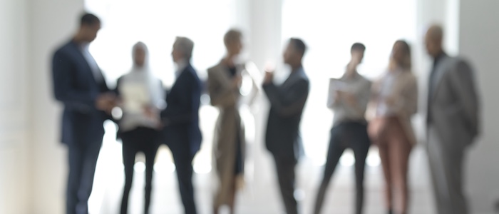 Blurred Photo of People in Meeting