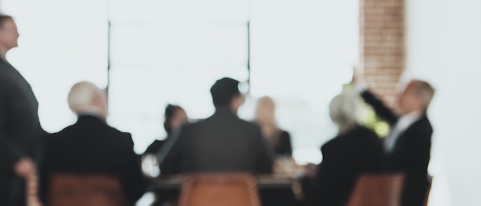 Blurred Photo of People in Meeting