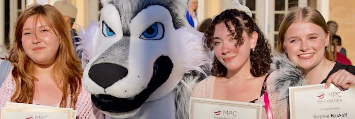 MPC Students Posing with Louie and Holding Scholarship Certificates